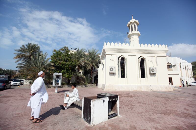 Two men chat before noon prayers on January 2, 2010,  in the Al Zaab neighborhood of Abu Dhabi. Sammy Dallal / The National