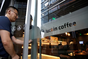 A man walks into a Luckin Coffee store in Beijing. Luckin, founded in 2017, raised $645m in its US IPO last year and counted BlackRock among its backers. Reuters