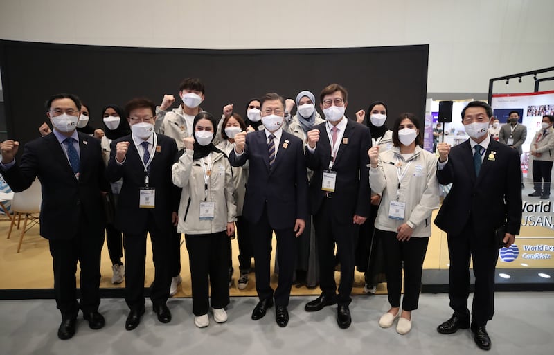 South Korean President Moon Jae-in poses with local supporters to promote Busan's bid for the 2030 World Expo during a visit to Expo 2020 in Dubai.   EPA 