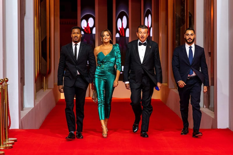 (L to R) Nate Parker, Bushra Roza, Tarak Ben Ammar and Jad Ben Ammar arrive for the screening of "Sisters in Arms" during the third edition of the Gouna Film Festival (GFF), in the Egyptian Red Sea resort of el-Gouna on September 21, 2019.  / AFP / El Gouna Film Festival / Ammar Abd Rabbo
