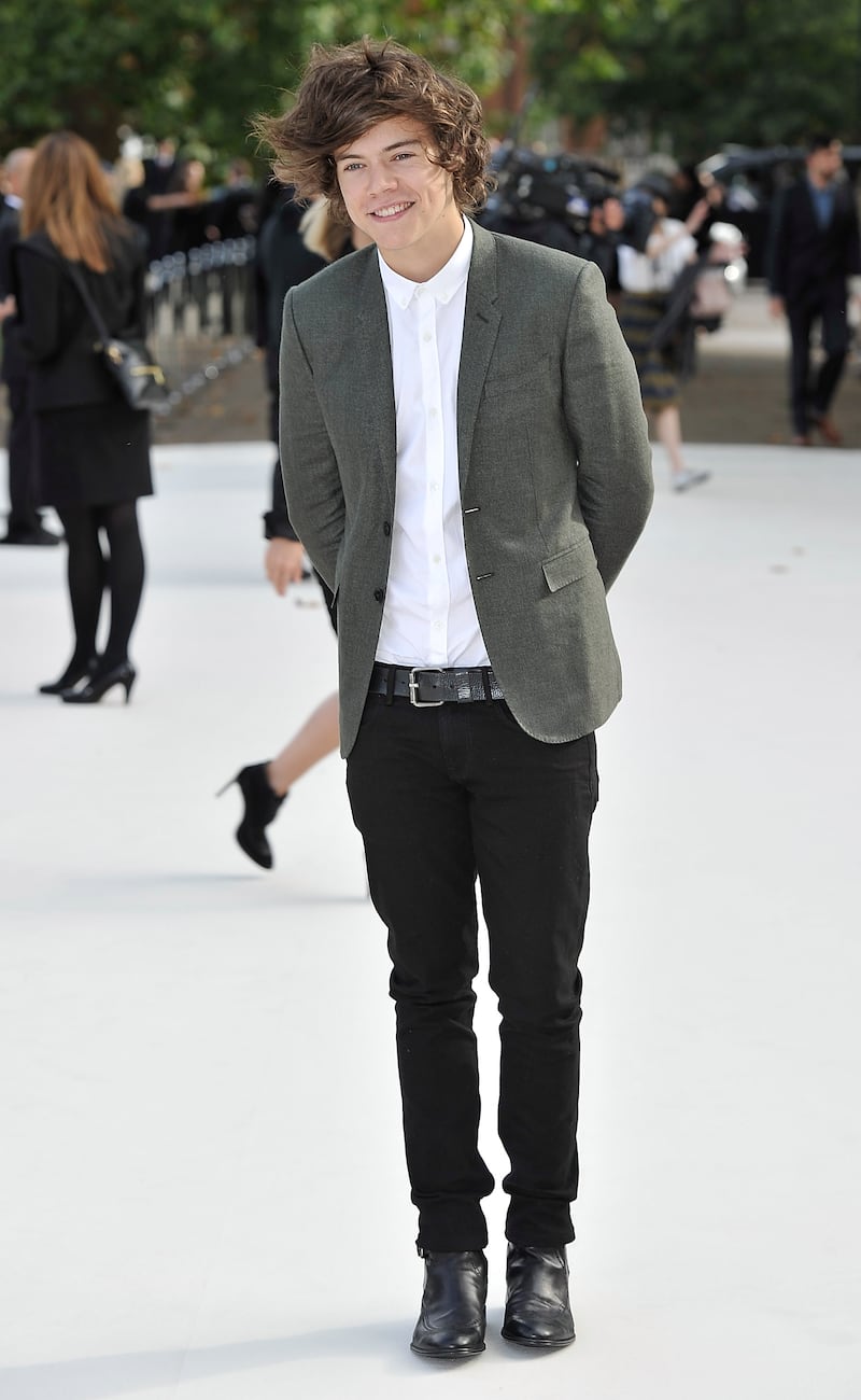 LONDON, ENGLAND - SEPTEMBER 17:  Harry Styles arrives at the Burberry Spring Summer 2013 Womenswear Show at Kensington Gardens on September 17, 2012 in London, England.  (Photo by Gareth Cattermole/Getty Images for Burberry)