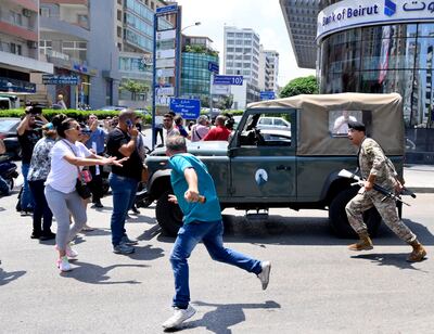 Bank customers clash with Lebanese army soldiers during a protest organized by Depositors' Outcry, at Sin El Fil area in Beirut. EPA