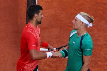 PARIS, FRANCE - JUNE 02: Novak Djokovic of Serbia shakes hands with Alejandro Davidovich Fokina of Spain after the Men's Singles Third Round match on Day Six of the 2023 French Open at Roland Garros on June 02, 2023 in Paris, France. (Photo by Clive Brunskill / Getty Images)