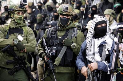 Palestinian gunmen during a memorial service in the Jenin refugee camp in the Israeli-occupied West Bank, March 3, 2023. Reuters.