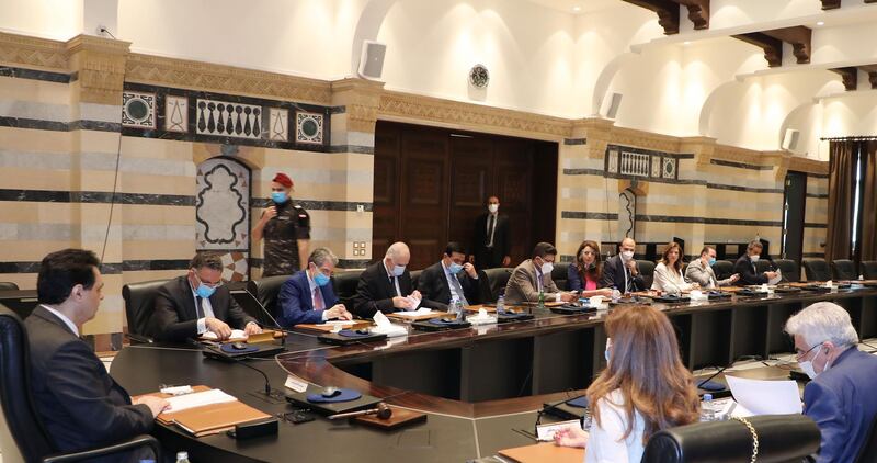 A handout picture provided by the Lebanese photo agency Dalati and Nohra on June 12, 2020 shows Prime Minister Hassan Diab (L) chairing an emergency cabinet session with other mask-clad ministers (due to the COVID-19 coronavirus pandemic) at the government palace in the centre of the capital Beirut. === RESTRICTED TO EDITORIAL USE - MANDATORY CREDIT "AFP PHOTO / HO / DALATI AND NOHRA" - NO MARKETING - NO ADVERTISING CAMPAIGNS - DISTRIBUTED AS A SERVICE TO CLIENTS ===
 / AFP / DALATI AND NOHRA / - / === RESTRICTED TO EDITORIAL USE - MANDATORY CREDIT "AFP PHOTO / HO / DALATI AND NOHRA" - NO MARKETING - NO ADVERTISING CAMPAIGNS - DISTRIBUTED AS A SERVICE TO CLIENTS ===
