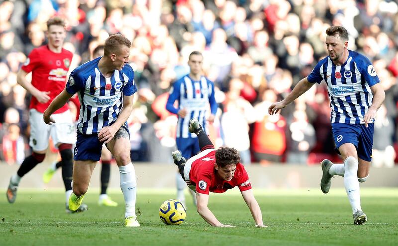 Manchester United's Daniel James has a tough time against Brighton and Hove Albion's Dan Burn at Old Trafford. Reuters