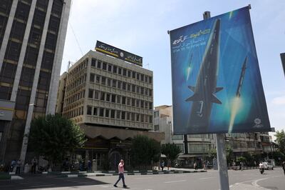 A banner of Iran's new hypersonic ballistic missile called 'Fattah' and with text reading '400 seconds to Tel Aviv', in Tehran. Photo: Wana