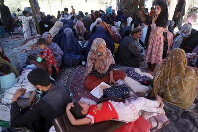 Families displaced from northern provinces, who fled their homes amid fighting between the Taliban and Afghan security forces, take refuge in a public park in Kabul. AP