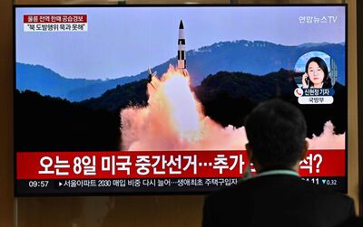 A television screen at a railway station in Seoul shows a news broadcast with footage of a North Korean missile test. AFP