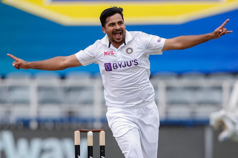 TOPSHOT - India's Shardul Thakur celebrates after the dismissal of South Africa's Temba Bavuma (not seen) during the second day of the second Test cricket match between South Africa and India at The Wanderers Stadium in Johannesburg on January 4, 2022.  (Photo by PHILL MAGAKOE  /  AFP)