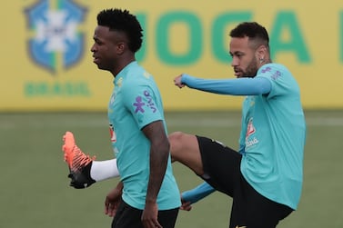 Players of Brazilian national soccer team Vinicius Junior (L) and Neymar in action during a training session at sports complex Granja Comary in Teresopolis, Brazil, 23 March 2022.  Brazil will face Chile as part of South American qualifiers for the Qatar 2022 World Cup.   EPA / ANDRE COELHO