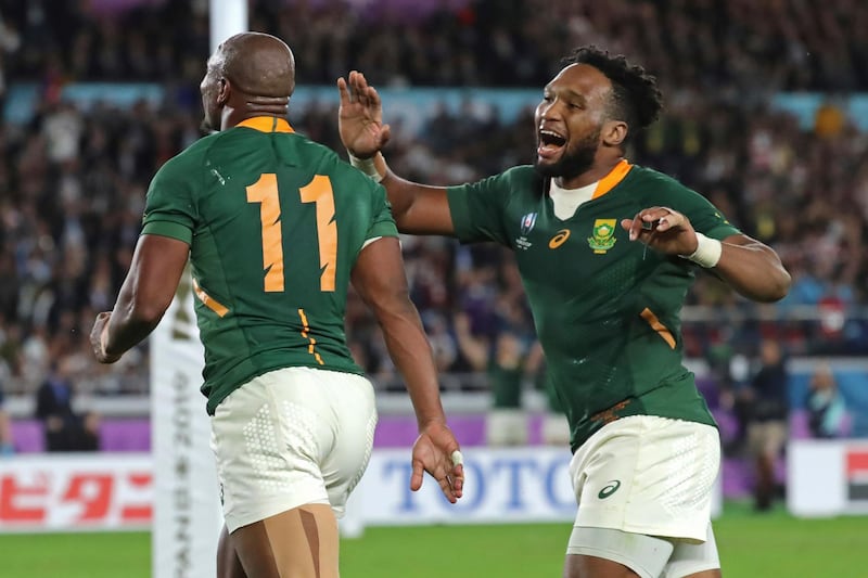 Makazole Mapimpi, left, celebrates with Lukhanyo Am after scoring South Africa's try against England in the Rugby World Cup final. AP Photo