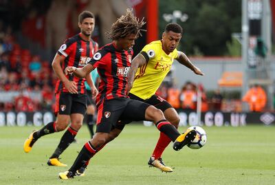 Soccer Football - Premier League - AFC Bournemouth vs Watford - Bournemouth, Britain - August 19, 2017   Watford's Andre Gray in action with Bournemouth's Nathan Ake    REUTERS/Peter Nicholls     EDITORIAL USE ONLY. No use with unauthorized audio, video, data, fixture lists, club/league logos or "live" services. Online in-match use limited to 45 images, no video emulation. No use in betting, games or single club/league/player publications. Please contact your account representative for further details.
