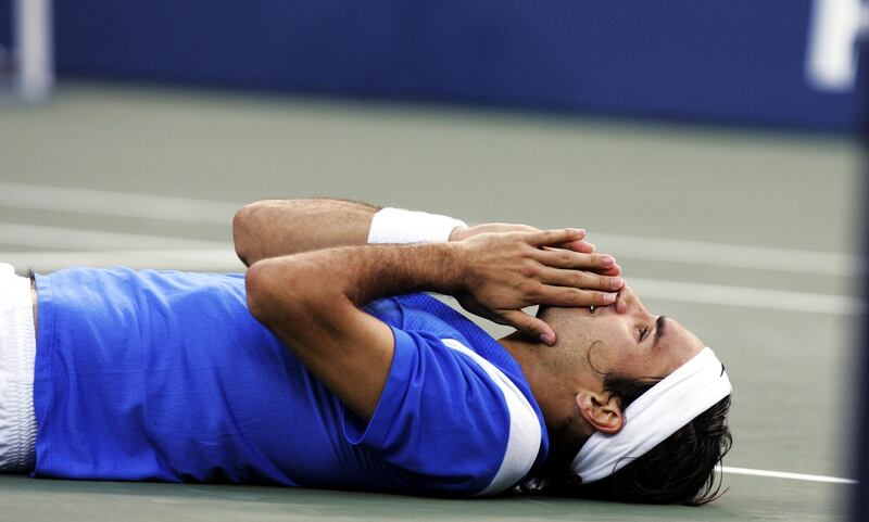 UNITED STATES - SEPTEMBER 12:  Roger Federer of Switzerland reacts after beating defending champion Lleyton Hewitt of Australia in the U.S. Open men's singles final at Arthur Ashe Stadium. Federer won in straight sets, 6-0, 7-6, 6-0, to become the first man to win three Grand Slam titles in one year since Mats Wilander in 1988.  (Photo by Corey Sipkin/NY Daily News Archive via Getty Images)