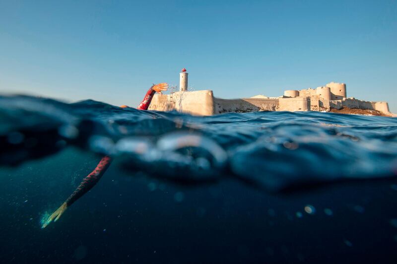 A swimmer competes during the 22nd edition of the "Le Defi Monte-Cristo" competition over 5 kilometres between Chateau d'If island and Marseille, southeastern France, on Sunday, September 13. AFP