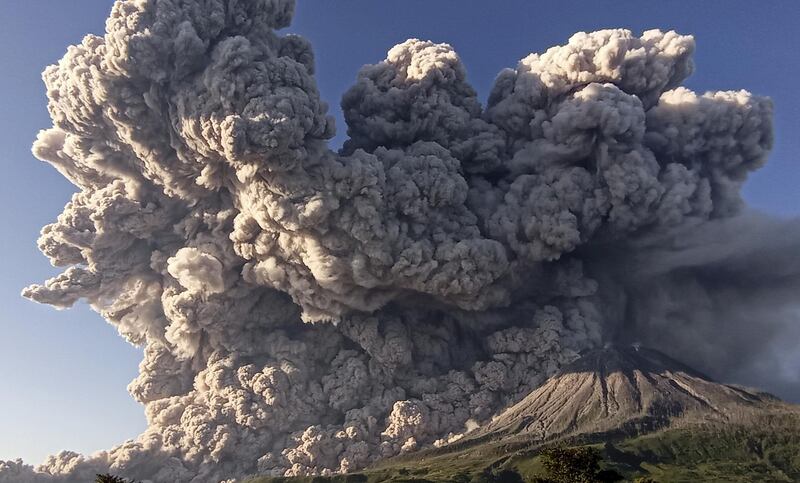 Ash rises into the sky above Kuta Rakyat village in Karo, North Sumatra, after Mount Sinabung erupts. Reuters