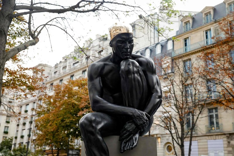 The Sculpture 'The Thinker' is displayed on the Avenue George V. It is now on loan to Louvre Abu Dhabi. AFP