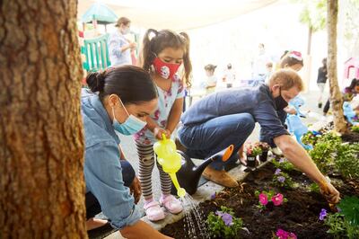 Prince Harry and Meghan Markle, the Duke and Duchess of Sussex, plant flowers and forget-me-nots during a visit to the Assistance League Los Angeles' Preschool Learning Center in Los Angeles, California, U.S. August 31, 2020, in this picture obtained from social media. Picture taken August 31, 2020. Mandatory credit MATT SAYLES/via REUTERS ATTENTION EDITORS - THIS IMAGE HAS BEEN SUPPLIED BY A THIRD PARTY. MANDATORY CREDIT. NO RESALES. NO ARCHIVES.