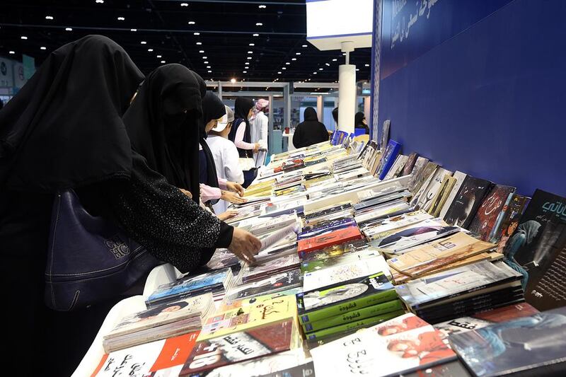 Above, visitors at the Abu Dhabi International Book Fair at Adnec in Abu Dhabi. Satish Kumar / The National 