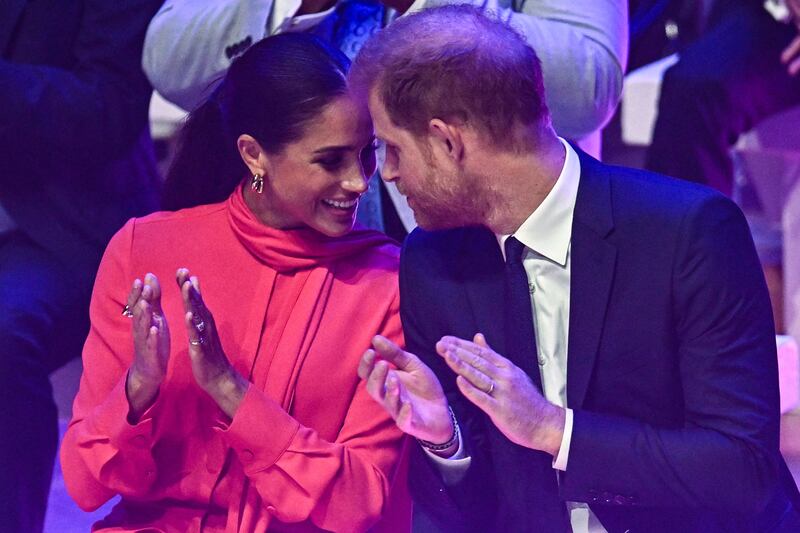 Meghan and Britain's Prince Harry applaud at Bridgewater Hall in Manchester. AFP