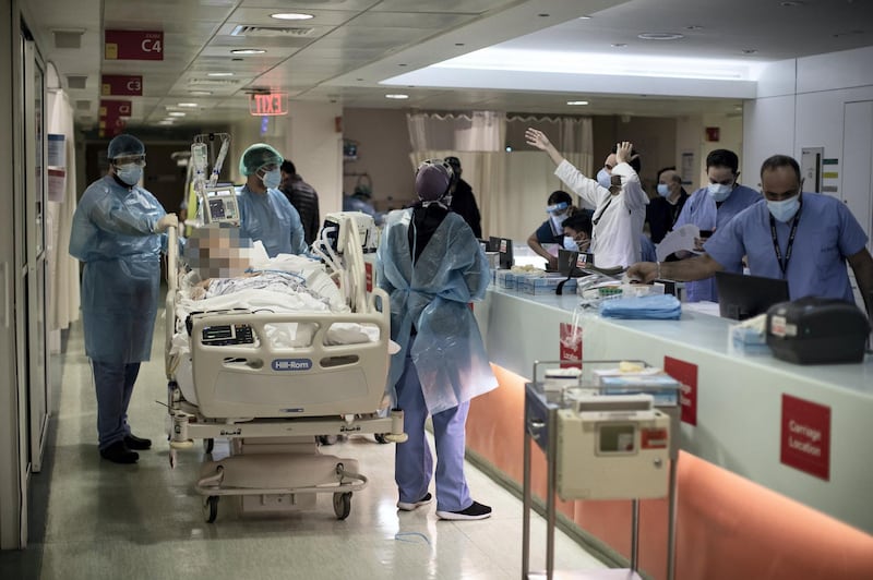 [NOTE TO EDITORS: The face of the patient has been blurred to protect identity] ©2021 Tom Nicholson. 18/01/2021. Beirut, Lebanon. A patient is moved in the Emergency Room (ER) at the American University of Beirut (AUB) Hospital. Deaths from Coronavirus in Lebanon reached a peak high of 53 today. Photo credit : Tom Nicholson