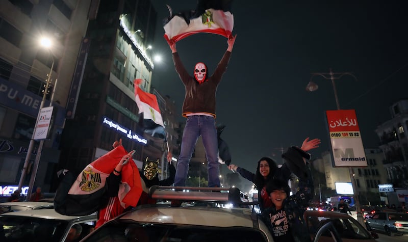 Egyptian fans celebrate in Cairo after their team defeated Cameroon to reach the Africa Cup of Nations final. 