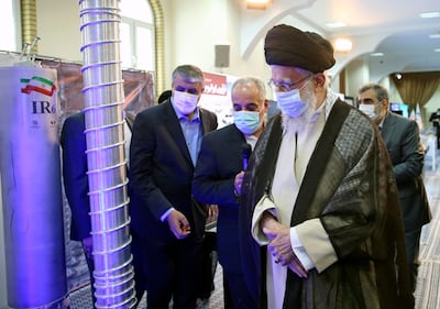 Ayatollah Ali Khamenei, Iranian supreme leader, right, visits an exhibition of the country's nuclear achievements, in Tehran. AP