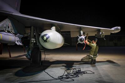Soldiers prepare a British fighter jet for air strikes against Houthi military targets in Yemen, at the Royal Air Force Akrotiri base in Cyprus. AP