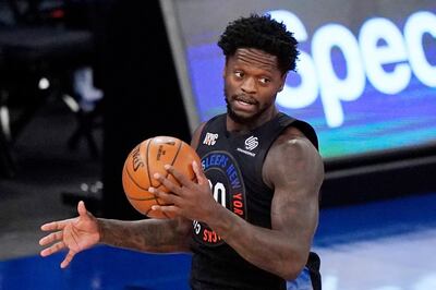 New York Knicks forward Julius Randle (30) holds onto the ball before driving down court during the first half of an NBA basketball game against the Orlando Magic, Monday, Jan. 18, 2021, in New York. (AP Photo/Kathy Willens, Pool)