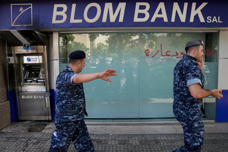 Lebanese policemen at the scene. AP