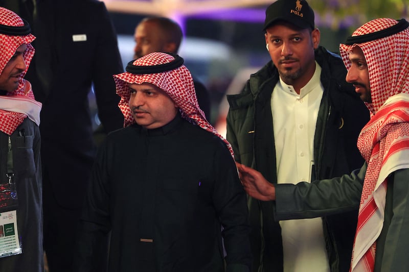 President of Al Nassr football club Musalli Al Muammar, centre, arrives at the Mrsool Park Stadium in Riyadh on Tuesday. AFP