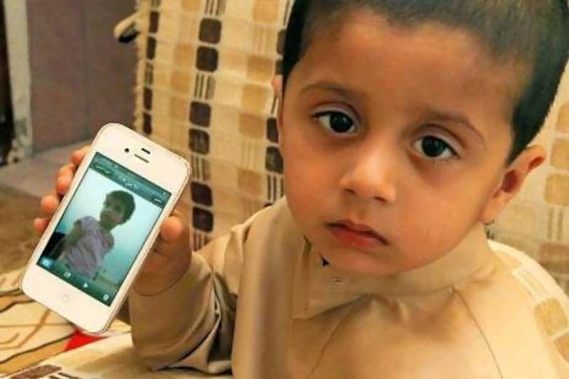 Nawaf Yousef Ali Johar with an image of his sister Khadija.