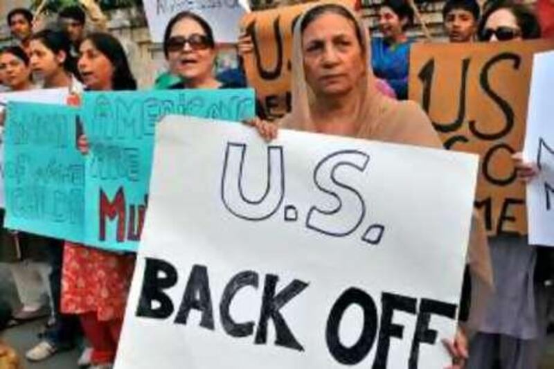 Pakistani civil right activists protest against the US missile strikes in the country's tribal areas in Lahore on September 14, 2008. A missile from a suspected US drone killed 12 people September 12 in a Pakistani tribal area where US forces have been aggressively targeting Al-Qaeda militants -- fuelling anger from Washington's key "war on terror" ally. AFP PHOTO/Arif ALI *** Local Caption ***  270033-01-08.jpg