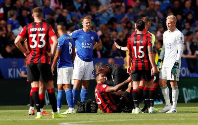 Soccer Football - Premier League - Leicester City v AFC Bournemouth - King Power Stadium, Leicester, Britain - August 31, 2019  Bournemouth's Callum Wilson receives medical attention after sustaining an injury   Action Images via Reuters/Andrew Boyers  EDITORIAL USE ONLY. No use with unauthorized audio, video, data, fixture lists, club/league logos or "live" services. Online in-match use limited to 75 images, no video emulation. No use in betting, games or single club/league/player publications.  Please contact your account representative for further details.