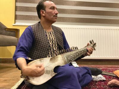 Ahmad Wali, 40, has been playing the rubab, a traditional Afghan instrument, since he was 15 years old. Hikmat Noori for The National