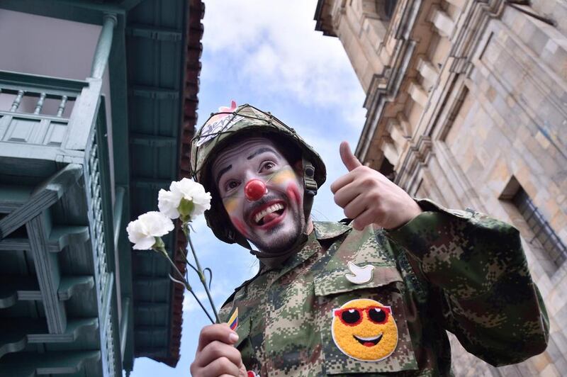 A man poses as he gathers with others at Bogota’s Bolivar main square to celebrate the historic peace agreement between the Colombian government and the Revolutionary Armed Forces of Colombia (FARC). AFP