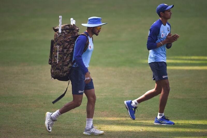 India's Manish Pandey, left, and Navdeep Saini arrive for their training session at the Wankhede Stadium on Sunday. AFP