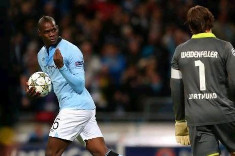 Mario Balotelli gestures toward Roman Weidenfeller, the Borussia Dortmund goalkeeper, after scoring from the penalty spot. Alex Livesey / Getty Images