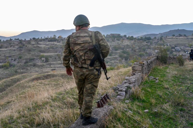 An Azeri soldier stands in the city of Jabrayil, where Azeri forces regained control during the fighting with Armenia over the breakaway region of Nagorno-Karabakh. AFP