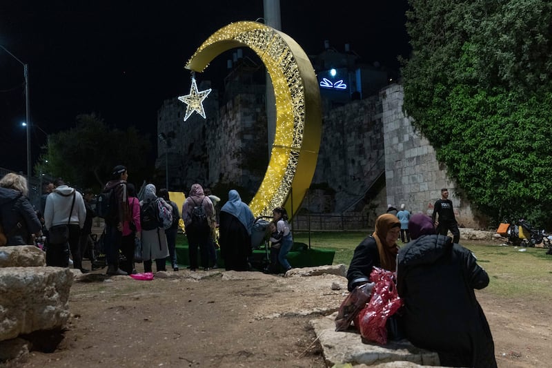 Decorative lights at the beginning of Ramadan at sunset on Wednesday, outside Jerusalem's Old City. AP