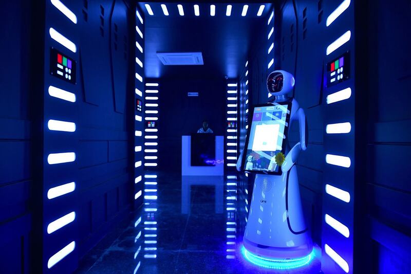 An interactive Android robot stands in the corridor. AFP