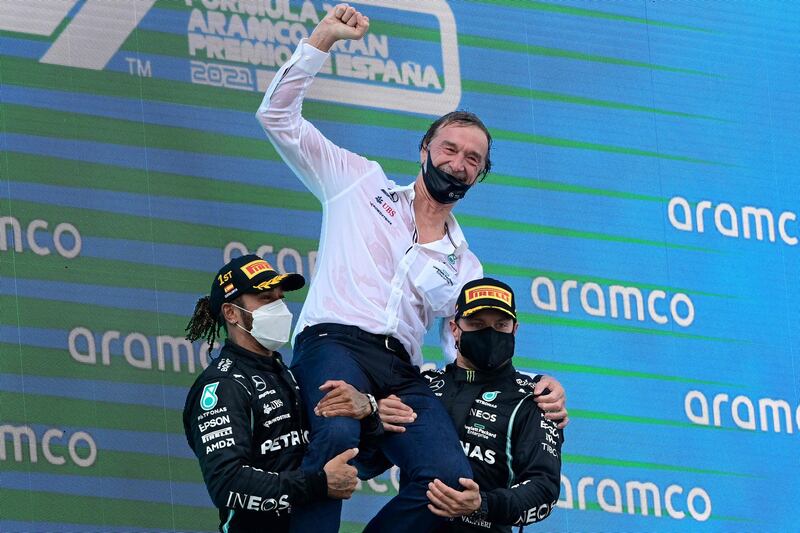 Mercedes' drivers Lewis Hamilton and Valtteri Bottas celebrate on the podium. AFP