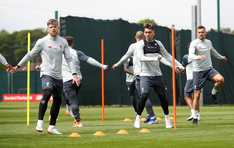 Alberto Moreno, Roberto Firmino and Dejan Lovren take part in training at Melwood. Reuters