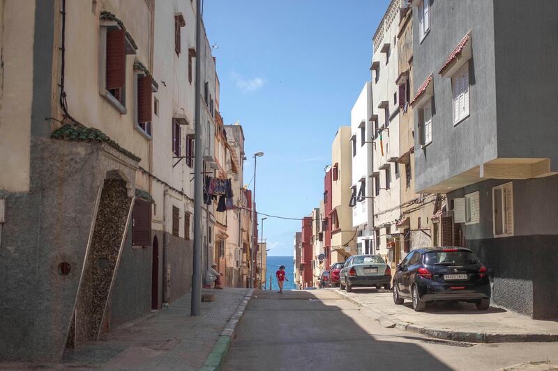 A girl plays in front of her home amid home confinement orders in the Ocean neighbourhood in Rabat, Morocco. AP Photo