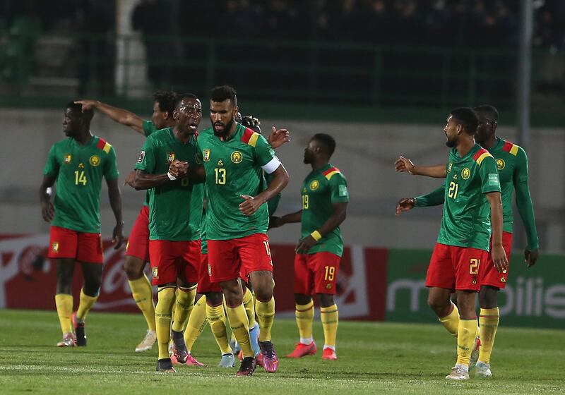 Cameroon players celebrate after scoring against Algeria  at the Mustapha Tchaker Stadium in Blida on March 29, 2022. EPA