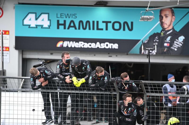 Mercedes pit crew celebrate British driver Lewis Hamilton winning the Eifel Grand Prix at the Nuerburgring circuit. AFP
