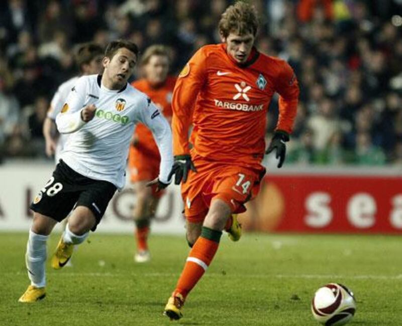 Valencia's Jordi Alba, left, chases after Werder Bremen's Aaron Hunt in the first leg at the Mestalla last week.