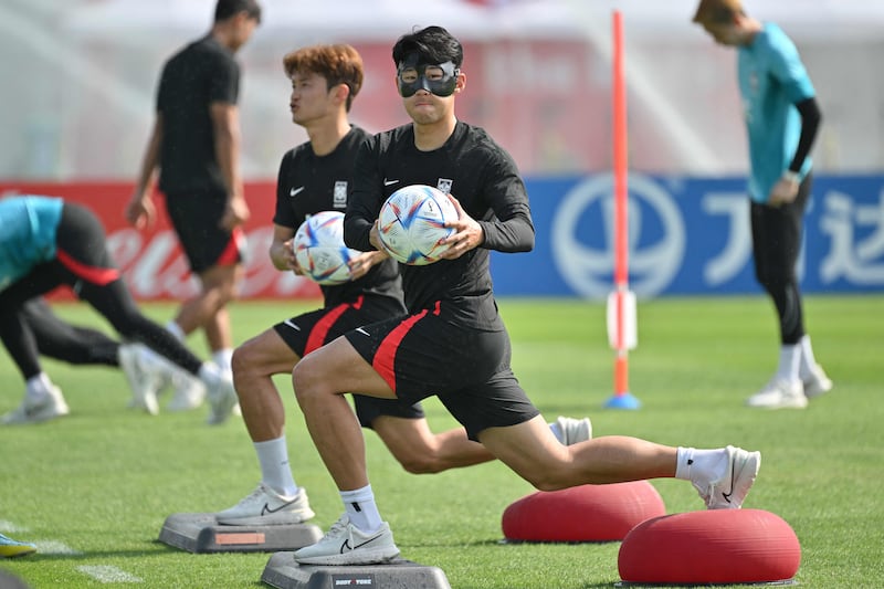 South Korea's Son Heung-min and defender Kim Jin-su train in Doha. AFP