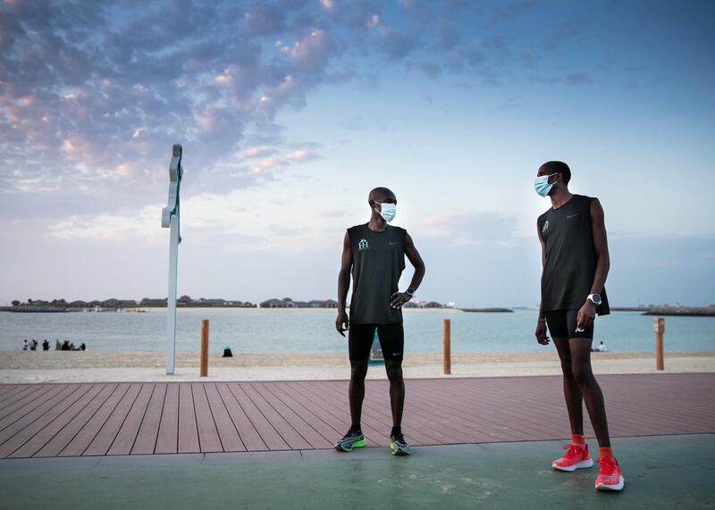 DUBAI, UNITED ARAB EMIRATES.  23 FEBRUARY 2021. 
Dennis Okwanga, left and Charles Rotich, train at Jumeirah's beach, 

Charles Rotich works as a pest-controller, grew up with the world’s top runner Eliud Kipchoge and they used to run together in the streets of Kenya as teenagers.

Photo: Reem Mohammed / The National
Reporter: Haneen Dajani
Section: NA