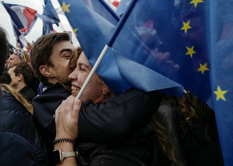 Overjoyed supporters congratulate each other after the announcement of the results. AP Photo